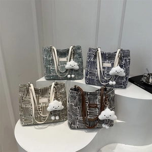 Minimalist canvas tote bags with artistic line texture and cute cloud charm in four colors