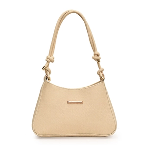 Cream woven shoulder bag with thick rope strap and gold hardware in minimalist saddle style