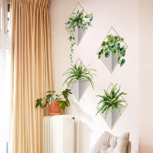 Detail of creative geometric plant wall stickers featuring realistic green leaves and gold frames