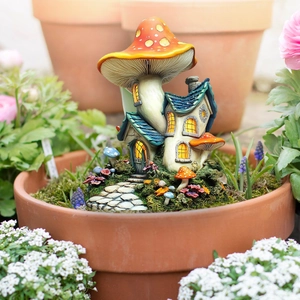 Macro detail of miniature mushroom tree house with warm LED window lights for garden decor