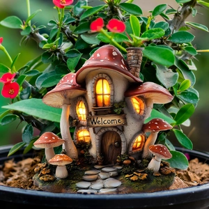 Detail of lit mushroom house garden stake with Welcome sign among green plants