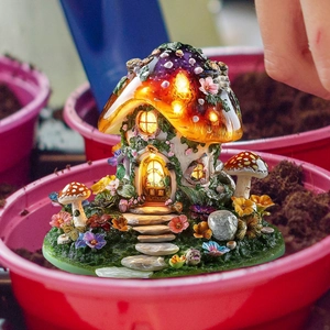 Luminous mushroom house garden stake with warm LED lights and fairy forest details