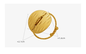 Macro detail of golden oval ring with scratched texture and dimension measurements