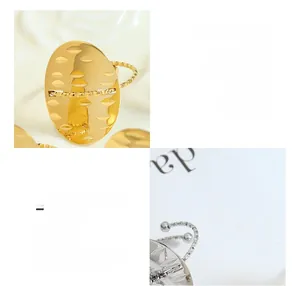 Detailed macro view of geometric oval rings with hammered texture in gold and steel finish