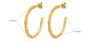 Detail view of gold-plated bamboo-style hoop earrings measuring 3.2cm in diameter