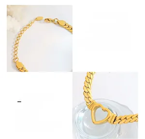 Detail of 18K gold plated surgical steel cuban chain with hollow heart charm