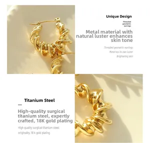 Macro detail of 18K gold plated twisted hoop earrings made of surgical titanium steel