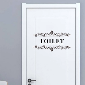 Black decorative TOILET door sticker with elegant European floral patterns on white wood door