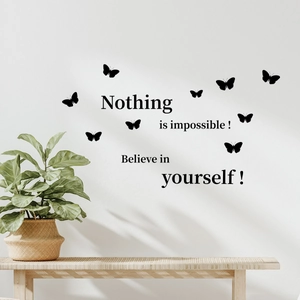 Detail of inspirational vinyl wall decals featuring flying butterflies and motivational text