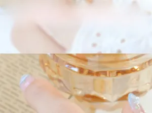 Detail of amber glass storage jar with geometric cut facets and vintage design