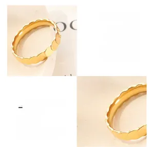 Macro detail of 18K gold plated titanium steel ring featuring 3D dragon scale texture
