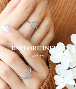 Detail of vintage style brass ring with square zircon worn on hand for lifestyle view
