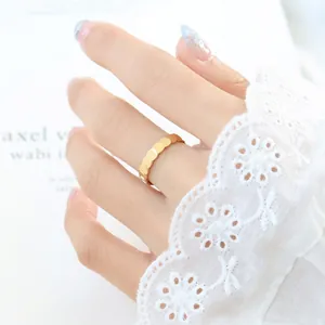 Elegant 18K gold-plated wave-patterned ring with layered scale design for men and women
