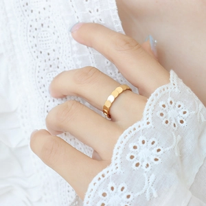Elegant gold titanium steel ring featuring a unique layered disk design for a textured look
