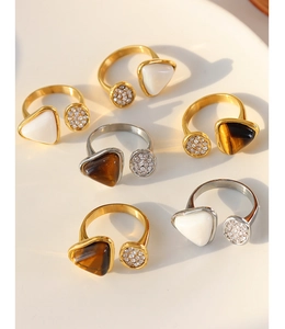 Collection of gold and silver tiger eye stone rings with micro-pave cubic zirconia detail