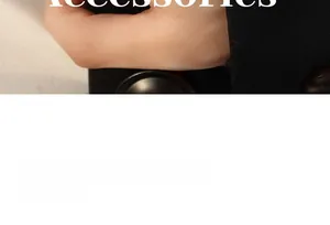 Close-up of minimalist chain ring on model hand with elegant dark business suit