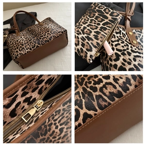 Detail of leopard print tote bag with brown leather handles and matching mini pouch