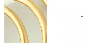 Macro detail of matte 18K gold plated bangle showing smooth frosted metal texture