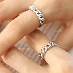 French style silver chain ring made of titanium steel worn on fingers in a lifestyle shot
