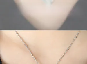 Detailed close-up of a silver beaded chain necklace with delicate minimalist ball accents