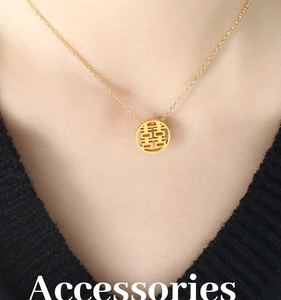 Macro detail of gold-plated titanium steel necklace with hollow Double Happiness pendant