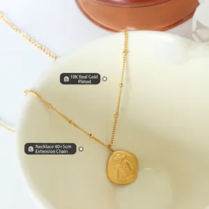 French style 18K gold plated necklace with abstract figure pendant on a fine beaded chain