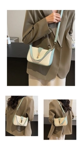 Detail of a contrast color small square bag with gold lock and stylish shoulder strap
