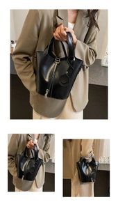 Détails d'un sac seau noir en cuir avec fermeture éclair dorée et pendentif cadenas chic