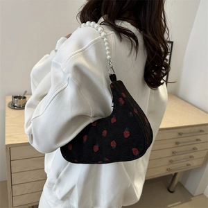 Fashionable black corduroy shoulder bag with strawberry prints and pearl chain strap