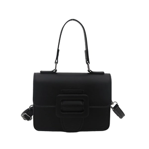 Minimalist black square handbag with matte leather finish and tonal buckle on white background