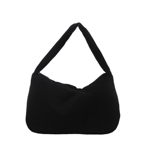 Minimalist black corduroy underarm shoulder bag with textured vertical stripes
