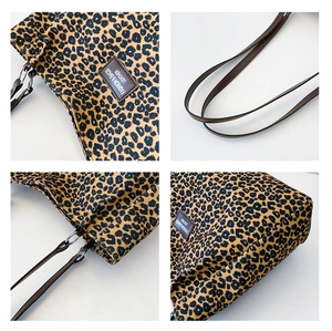 Close-up of leopard print tote bag detailing leather straps and fashion label tag