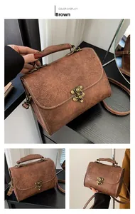 Close-up of vintage brown PU leather shoulder bag with European embossed floral patterns