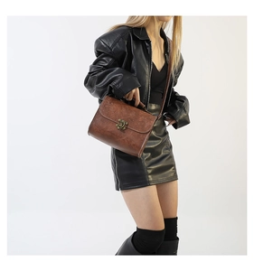 Brown vintage faux leather handbag with bronze lock and adjustable shoulder strap