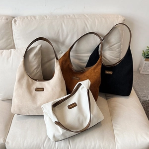 Large capacity corduroy tote bags in four neutral colors on a leather sofa for autumn winter