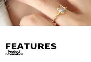 Macro shot of gold bead ring featuring a rectangular zircon stone and minimalist design