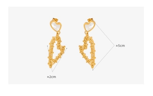 Detail view of gold-plated woven hollow heart earrings with shell inlay and size dimensions
