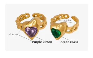 Detail view of heart crystal rings with Cuban link bands in purple and green finish