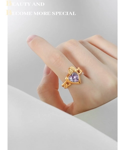 Detailed shot of gold plated heart shaped purple zircon ring with cuban chain band design