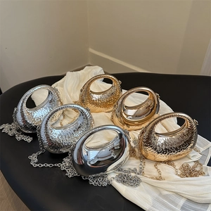 Miniature metal evening handbags in gold and silver finishes with elegant chain straps