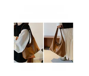Dual carrying styles of the brown tote bag shown as both shoulder and handheld options