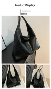 Detail view of large black soft leather hobo tote with minimalist seamless strap