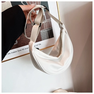 Detail of white nylon crescent bag showing high-quality fabric and adjustable shoulder strap