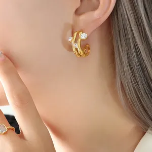 French vintage style gold wavy C-hoop earrings with zircon inlays for a chic luxury look