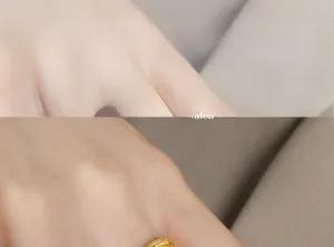Close-up of interlocking chain link ring in 18K gold finish on a model's finger