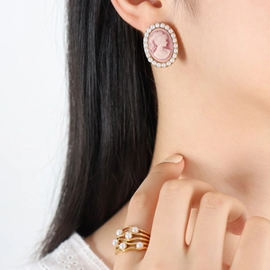 Pink vintage cameo earring with pearls and matching multi-layer gold pearl ring