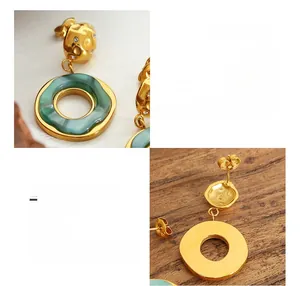 Detailed views of 18K gold plated titanium steel earrings with green resin and rhinestones
