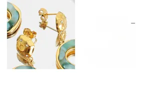 Macro view of French vintage geometric earrings with green resin and clear zircons