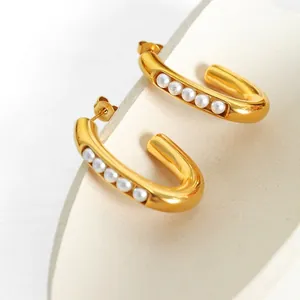 U-shaped gold plated titanium earrings with five inlaid faux pearls in a chic vintage style