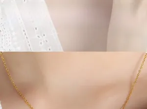 Close-up of minimalist gold-plated thin chain necklace showing fine craftsmanship